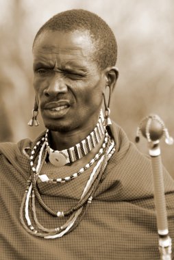AMBOSELI, KENYA ,OCT. 13: Portrait of young Maasai man taken on Oct 13, 2011 in Amboseli, Kenya. Maasai (Masai) are a Nilotic ethnic group of semi-nomadic people located in Kenya and northern Tanzania