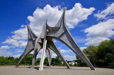 MONTREAL, CANADA - JUNE 19: The Alexander Calder sculpture L'Homme is a large-scale outdoor sculpture on june 19 2013 in Parc Jean-Drapeau, located in Montreal. Made for 1967 World Fair
