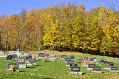 IRON HILL QUEBEC CANADA 10 07 2016: Holy Trinity cemetery. This cemetery is found beside the Holy Trinity Church, in the churchyard, which is in the a small and pretty town of Iron Hill 
