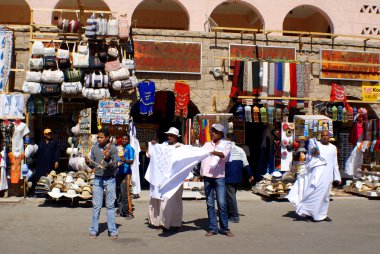 KARNAK EGYPT NOVEMBER 26:Men sale souvenirs in typical street market on november 26 2009 Karnak Egypt. More than 20 percent of Egypts 76 million people live below the poverty line.