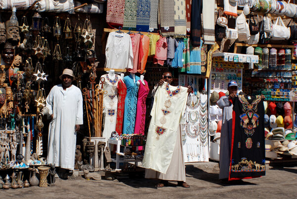 KARNAK EGYPT NOVEMBER 26:Men sale souvenirs in typical street market on november 26 2009 Karnak Egypt. More than 20 percent of Egypts 76 million people live below the poverty line.
