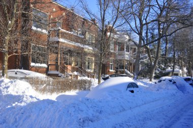 MONTREAL-CANADA DEC. 27:Cars cover of snow on Merose Street. The snow storm slam Montreal with 45 cm of snow, Canada on December 27, 2012 after knocking out power to thousands of homes in the U.S..