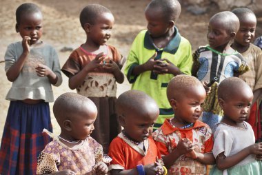 AMBOSELI, KENYA-OCT. 13: Portrait of unidentified young Maasai children on Oct 13, 2011 in Masai Mara, Kenya.