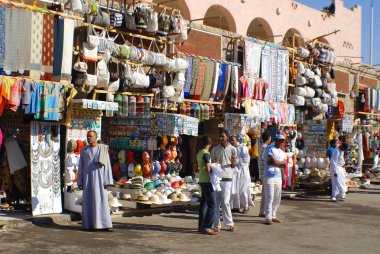 KARNAK EGYPT NOVEMBER 26:Men sale souvenirs in typical street market on november 26 2009 Karnak Egypt. More than 20 percent of Egypts 76 million people live below the poverty line.