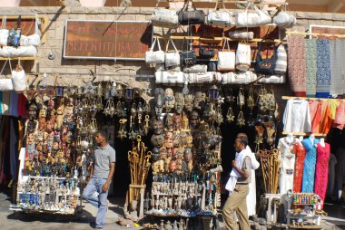 KARNAK EGYPT NOVEMBER 26:Men sale souvenirs in typical street market on november 26 2009 Karnak Egypt. More than 20 percent of Egypts 76 million people live below the poverty line.
