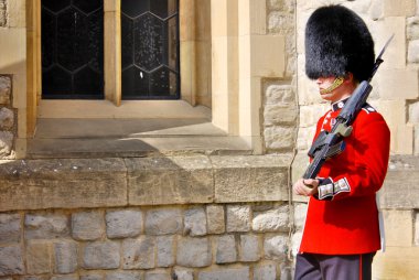 LONDON - JUNE 02:Queen's Guard - Tower of London on June 02 2012. The Queen's Guard is the contingents of infantry and cavalry soldiers charged with guarding the official royal residences.