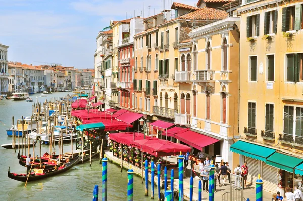 View of the Grand Canal is a canal in Venice, Italy. It forms one of the major water-traffic corridors in the city. Public transport is provided by water buses and private water taxis,