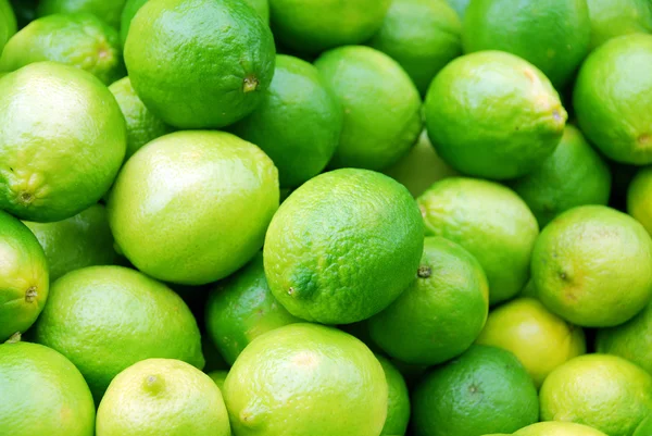 Fresh green limes background