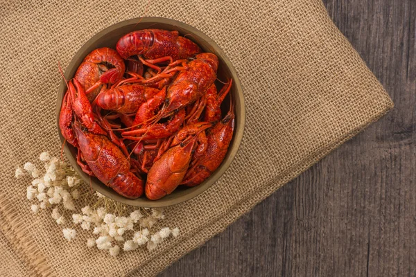 boiled big crawfish on the wooden surface
