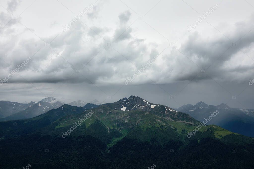 Landscape green mountain valley on a grey cloudy day. High quality photo