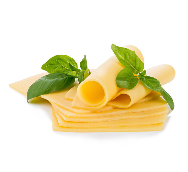 Slices of cheese with fresh basil leaves close-up isolated on a white background.