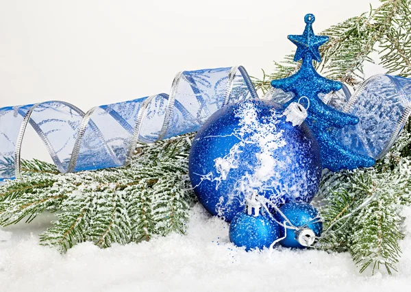 Beautiful blue Christmas balls on frosty fir tree. Christmas ornament — Stock Photo, Image