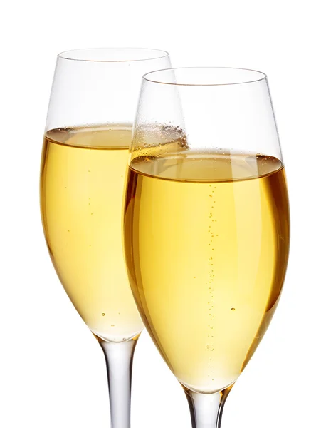 Two elegant champagne glasses close-up isolated on a white background. Festive still life. — Stock Photo, Image