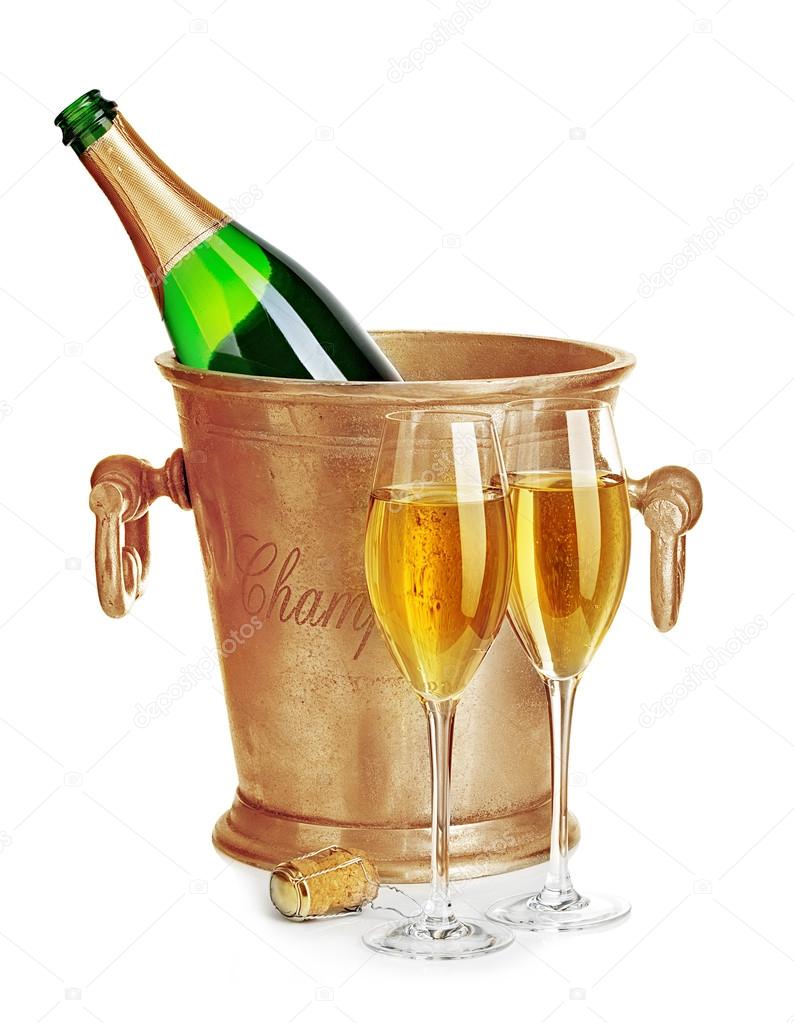 Champagne bottle in golden ice bucket with glasses of champagne close-up isolated on a white background. Festive still life.