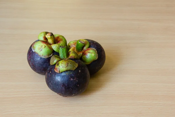 Mangosteens on table — Stock Photo, Image