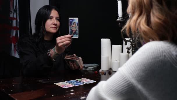 Fortune Teller Lays Out Tarot Cards Young Girl Sit Wooden — Stock Video