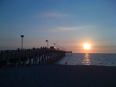 Sunset view on the river beside the bridge