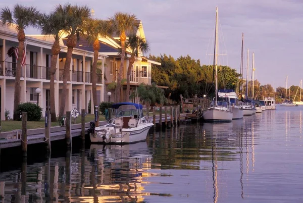 A beautiful house along with boats