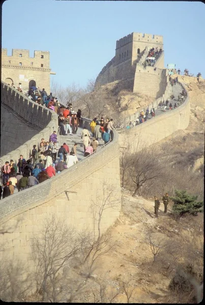 The great wall of china at early morning surrounded by people