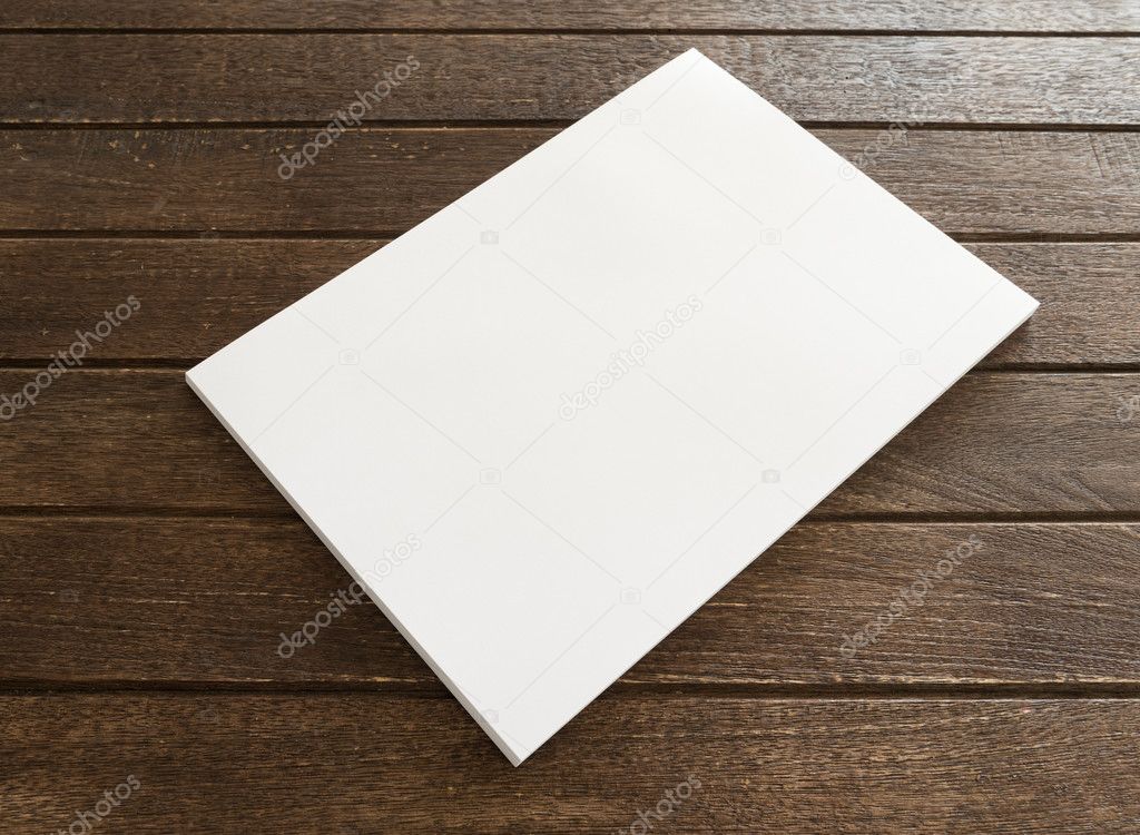 blank paper spread on wooden