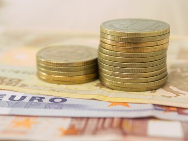 gold coin on euro banknote  background 