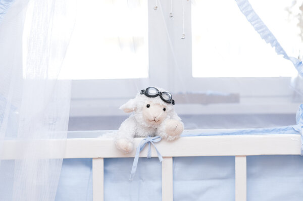Soft toy sheep in the nursery.