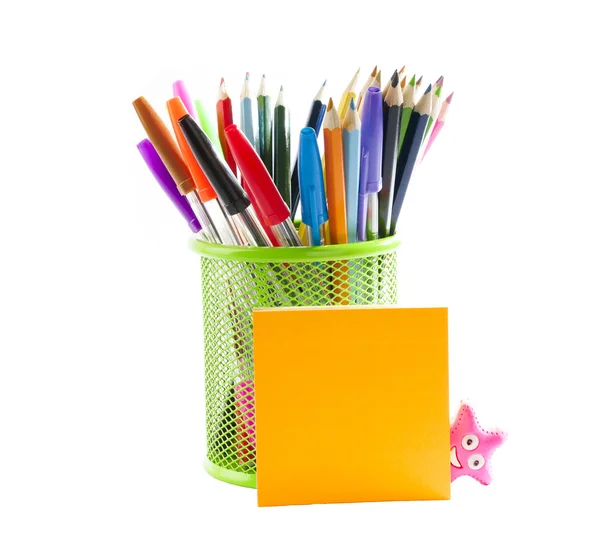 Colored pencils in a pencil stand and stick notes — Stock Photo, Image