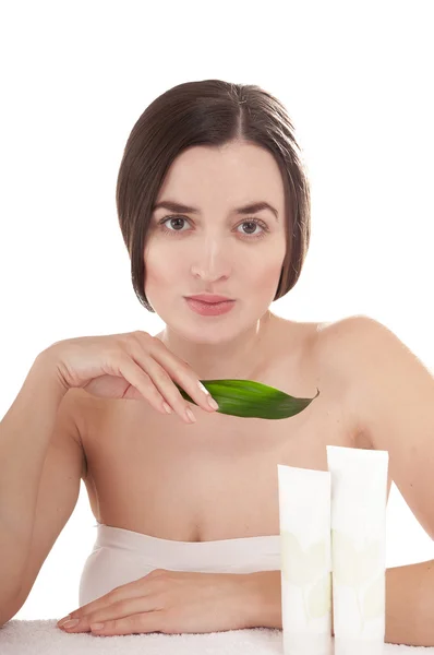 Woman with well-groomed skin near organic cosmetics — Stock Photo, Image