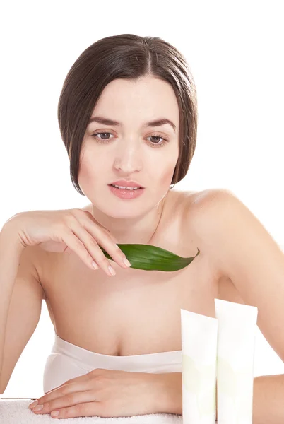 Woman with well-groomed skin near organic cosmetics — Stock Photo, Image