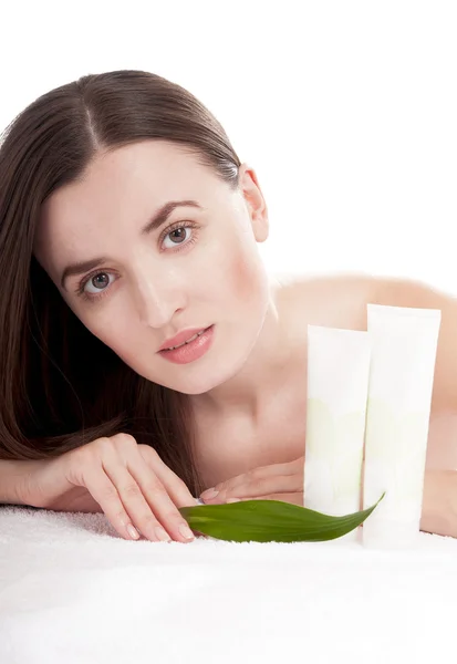 Woman with well-groomed skin near organic cosmetics — Stock Photo, Image