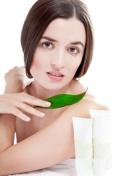 Woman with well-groomed skin near organic cosmetics — Stock Photo, Image