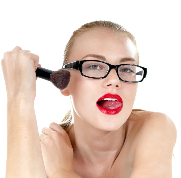 Beautiful girl with  a  brushes for makeup wearing black glasses — Stok fotoğraf