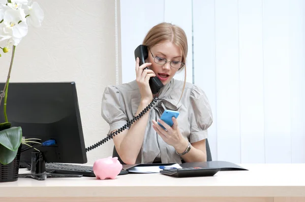 Busy business woman on landline phone call — Stock Photo, Image