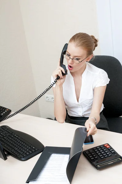 Busy office girl talking on mobile phone — Stock Photo, Image