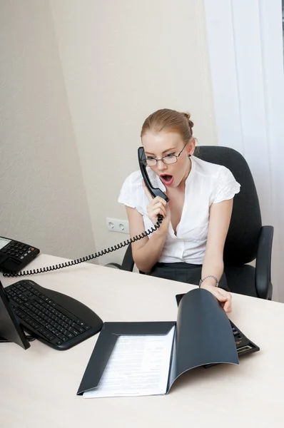 Busy office girl talking on mobile phone — Stock Photo, Image