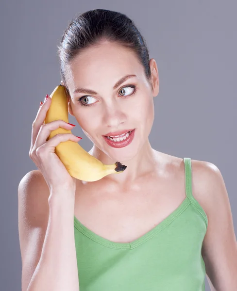 Charming woman with banana — Stock Photo, Image