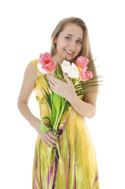 Portrait of a happy smiling  girl with a bouquet of spring tulip