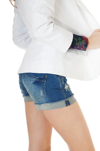 Side view of female body and legs in  blue jeans shorts — 스톡 사진