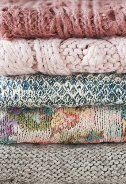 Knitted sweaters stacked — Stock Photo, Image