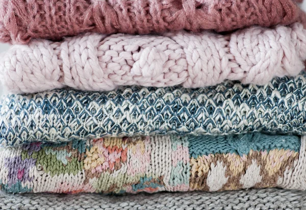 Closeup of knitted clothes stacked — Stock Photo, Image