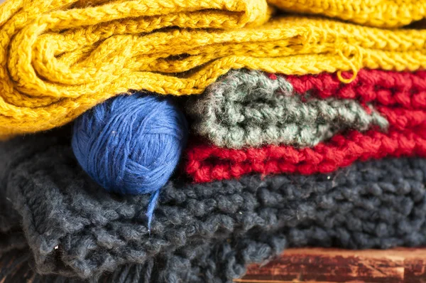 Colorful knitted clothes stacked — Stock Photo, Image