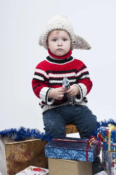 Toddler with gift boxes — Stock Photo, Image