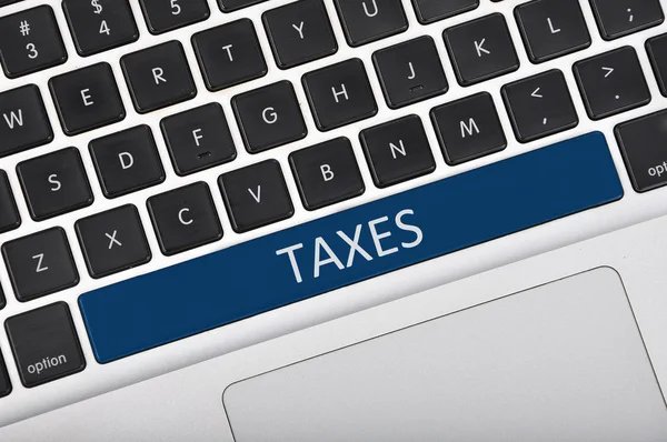 Clavier mot écrit taxes — Photo