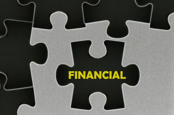 The black jigsaw puzzle  written word financial — Stock Photo, Image