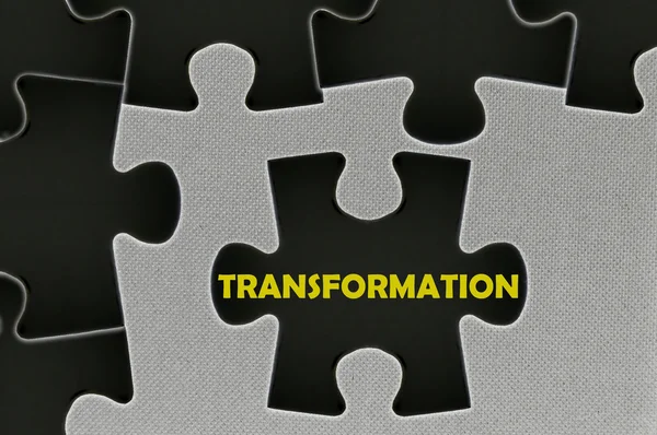 Jigsaw puzzle written word transformation — стоковое фото