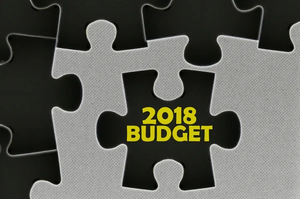 The black jigsaw puzzle written word 2018 budget