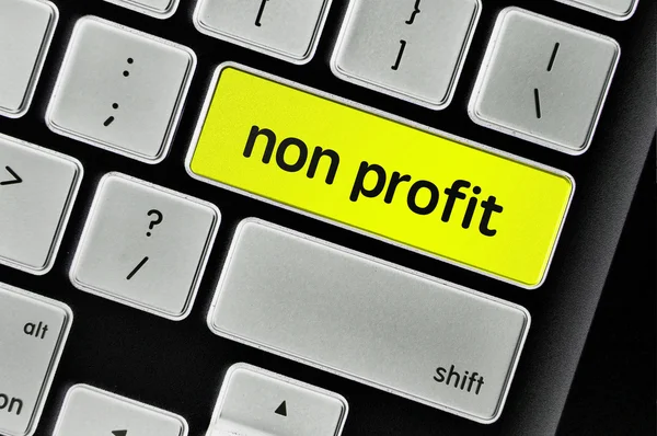 De computer toetsenbord knop geschreven woord non-profit — Stockfoto