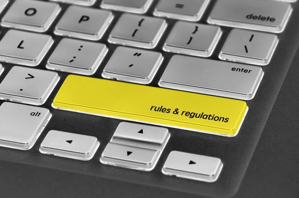 単語の規則・規制を書かれたキーボード ボタン — ストック写真