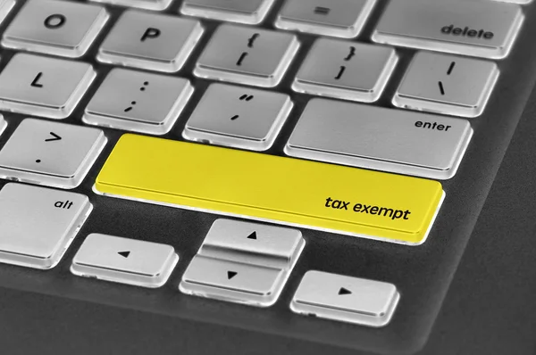 Tlačítko klávesnice napsal slovo osvobozené od daně — Stock fotografie