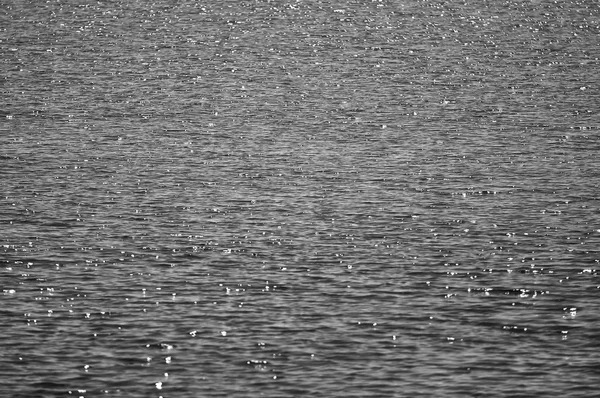 Selective Focus Of Water surface with waves glittering  in black — Stock Photo, Image